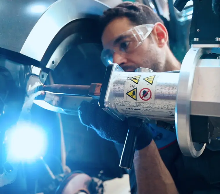Bodyshop Service An Expert Welding the Car Part