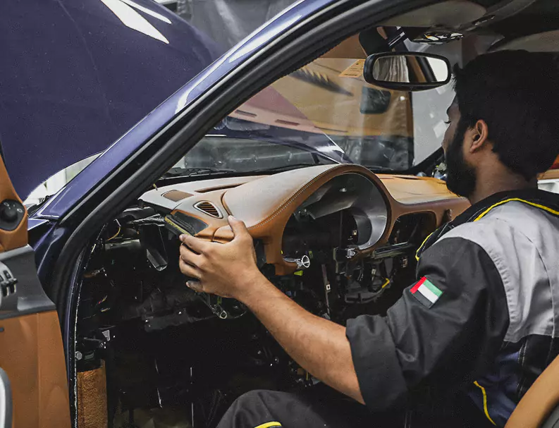 A German Expert Fixing the car Leather dashboard