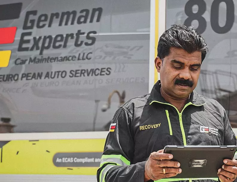 German Expert Standing with Holding the Tablet