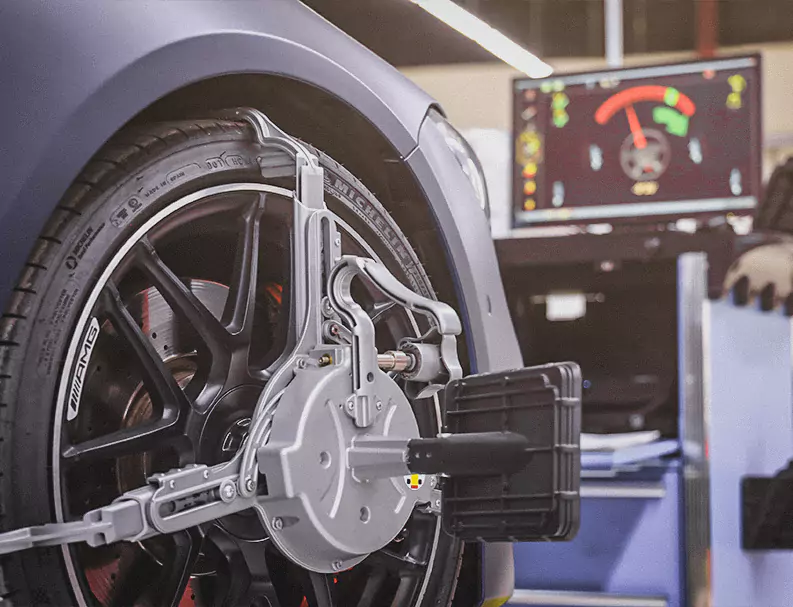 Wheel Alignment Machine Installed on car wheel to check the Alignment