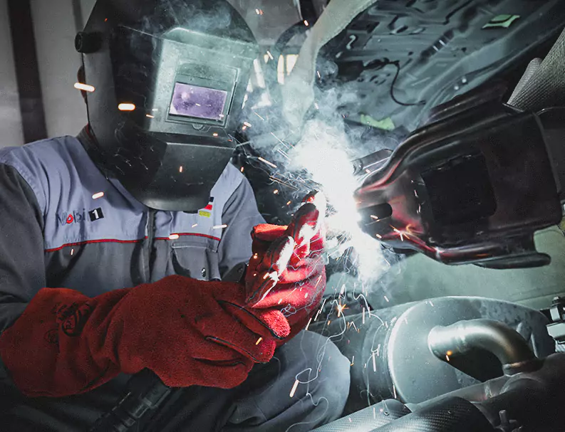 An Expert Welding The Car Parts