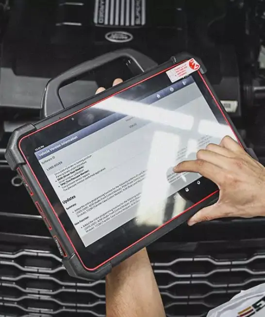 A Worker Scanning the issues on Tablet