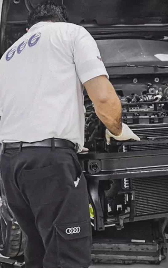 Two German Experts Fixing the Car Engine Cooling System