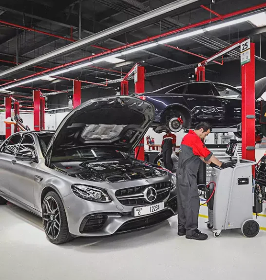 German Expert Connecting the Air Conditioning Machine with Mercedes Car