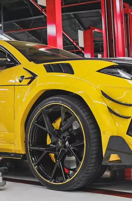 Yellow Car in German Experts Workshop for Speed Control Unit Repair Service