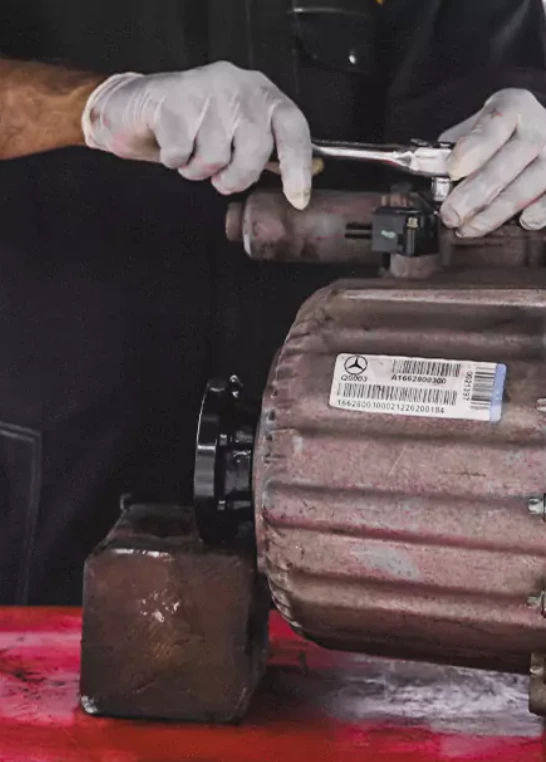 German Expert Fixing the Car Engine