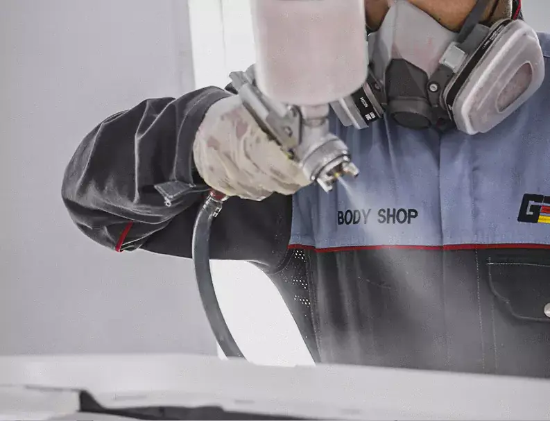 German Expert Spray Painting on Car Body Very Closely