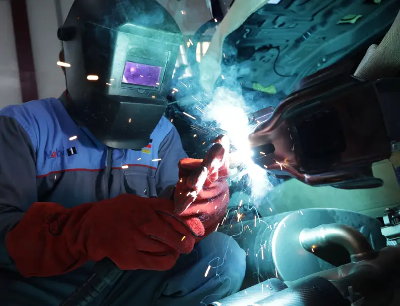 Worker Checking the Car Paint on Scanner Machine