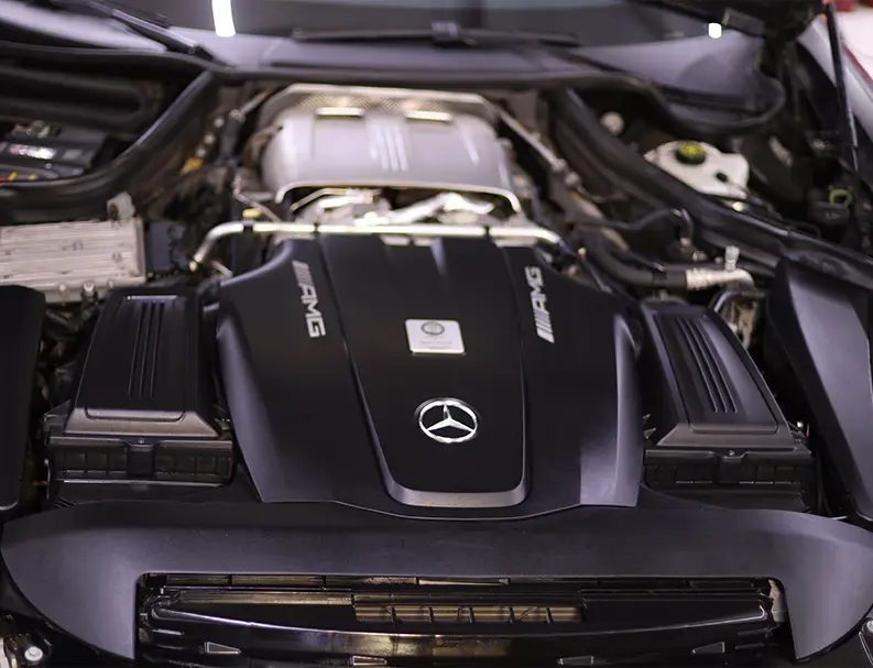 A Car Engine Management System Specialists Checking the Car Engine