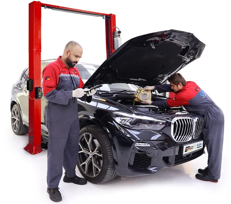 A German Expert Standing Along with Car at Workshop